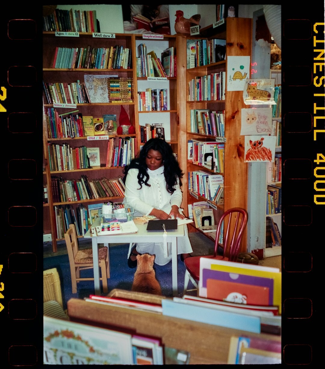 writer researching at desk with books